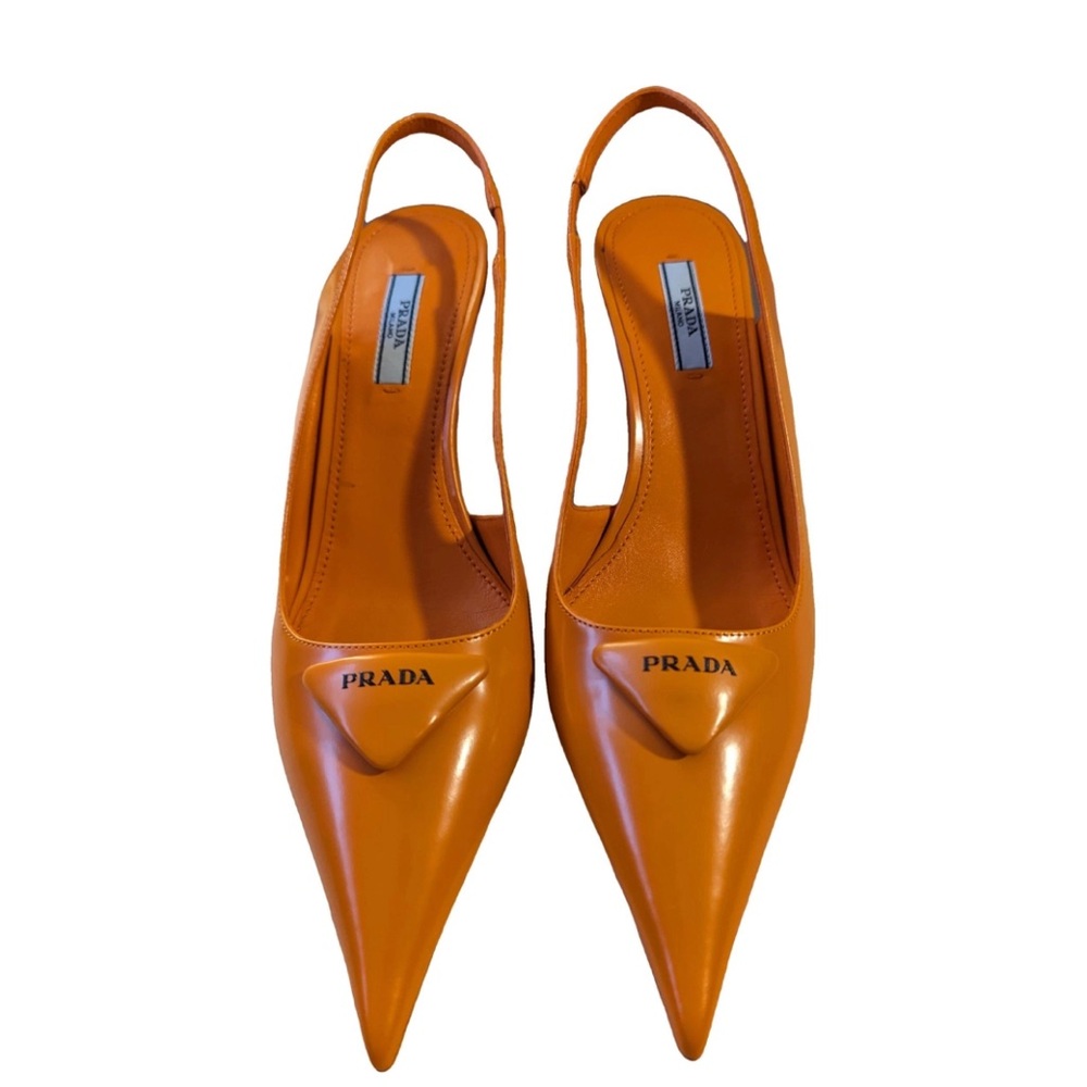 Orange Prada heels with unique heel shape
